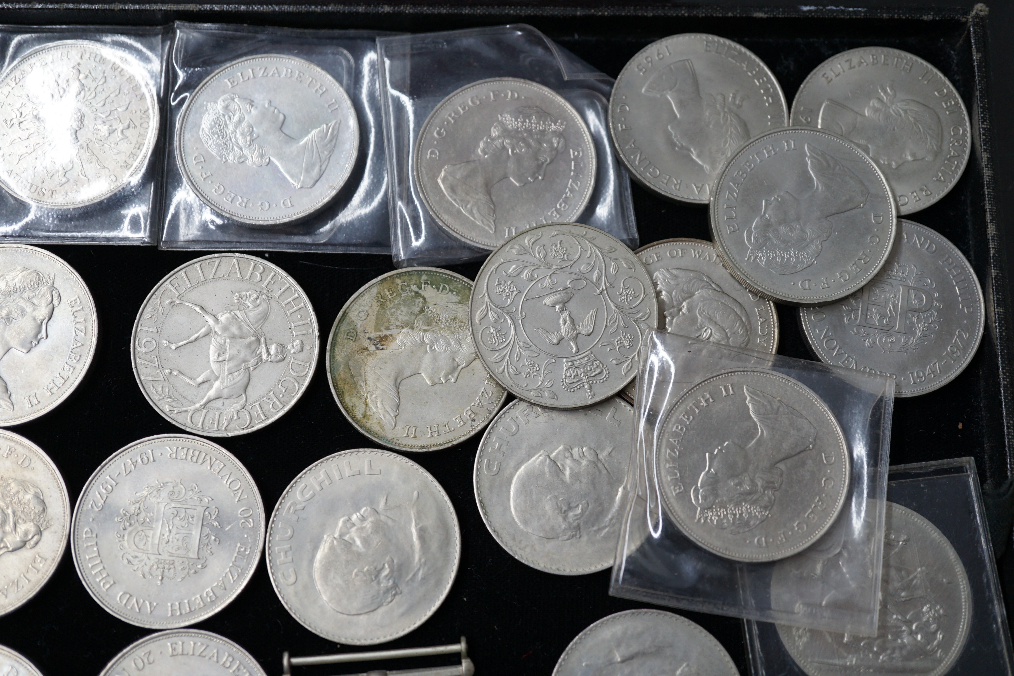 A group of QEII crowns and two medals